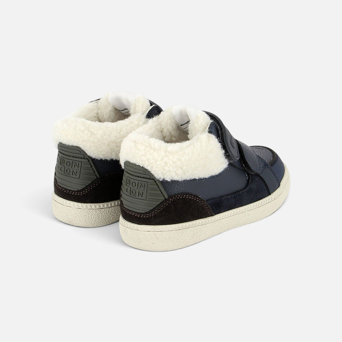 Baskets montantes Shoo Pom bleu marine en cuir avec doublure en fausse fourrure blanche et fermeture à scratch