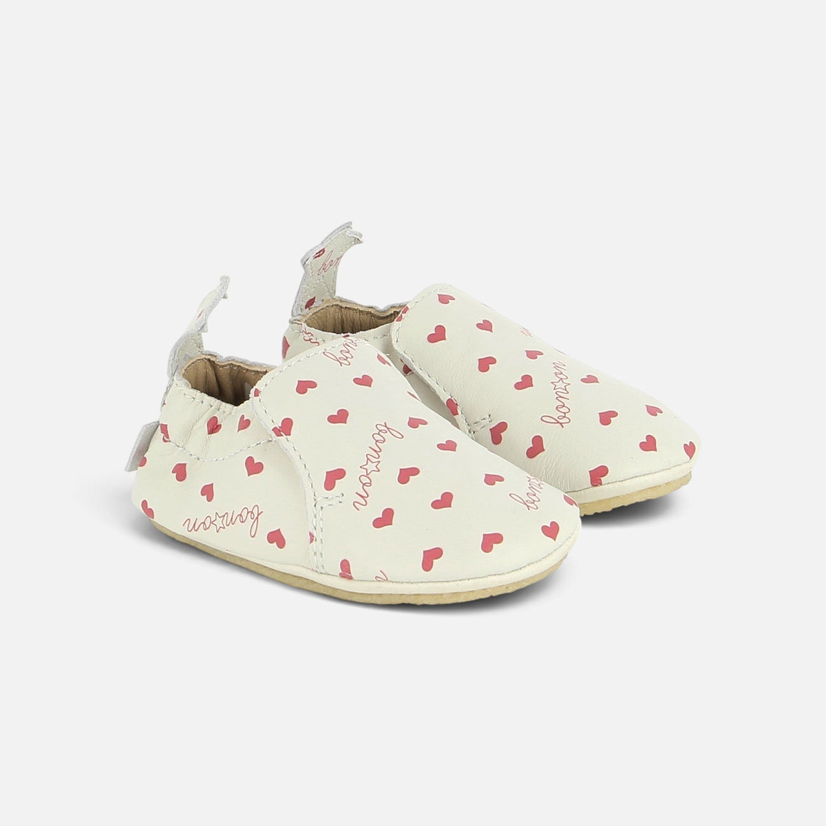 Chaussons souples Shoo Pom en cuir blanc avec motif cœurs roses et inscription cursive pour bébé